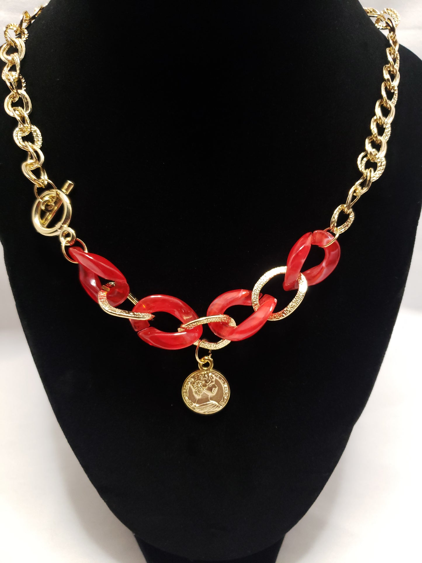 Red acrylic gold plated chain link necklace with coin pendant